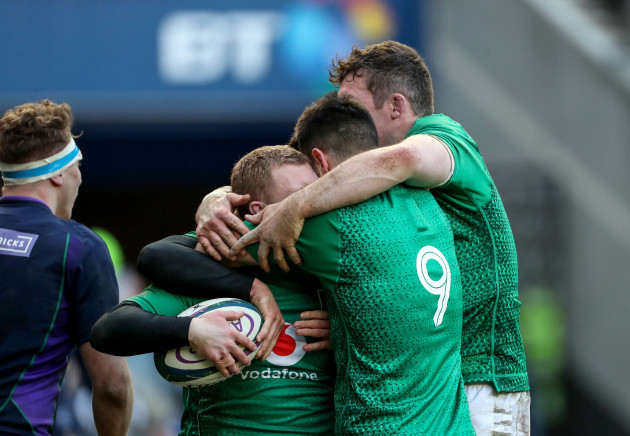 Keith Earls celebrates scoring their third try with Conor Murray and Peter O'Mahony