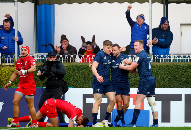 Dave Kearney celebrates his try with Rory O'Loughlin and Garry Ringrose
