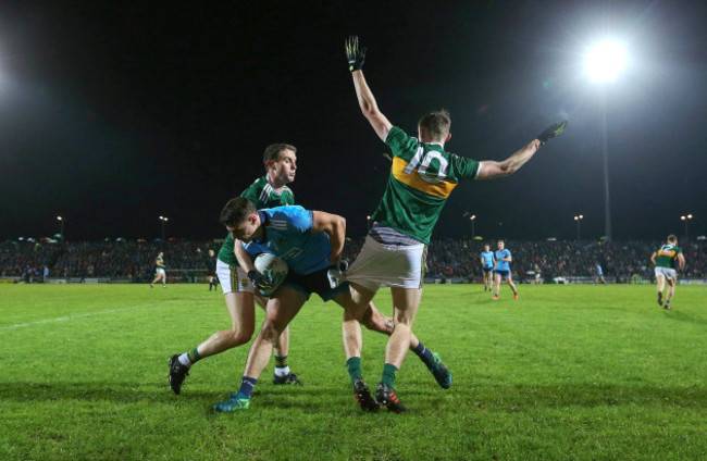 Tadgh Morley and Diarmuid O'Connor tackle Brian Howard