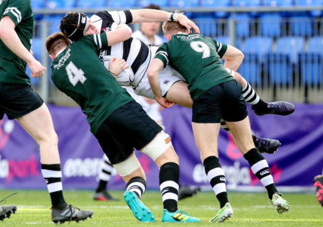 Cormac Yalloway is tackled by Diarmuid Mangan and Jack Doyle