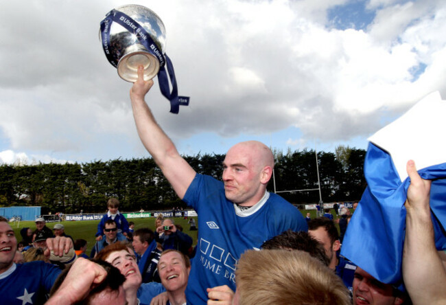 Hugh Hogan lifts the trophy