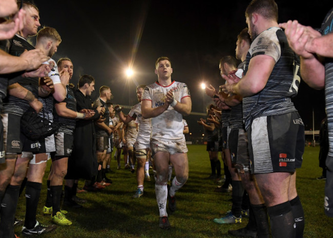 Darren Cave leads the Ulster team off the pitch