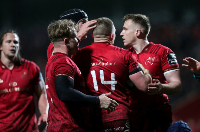 Andrew Conway is congratulated after scoring a try
