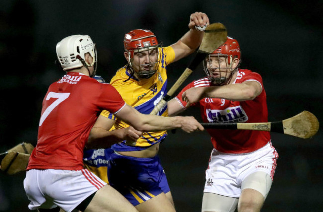 Peter Duggan is tackled by David Griffin and Bill Cooper