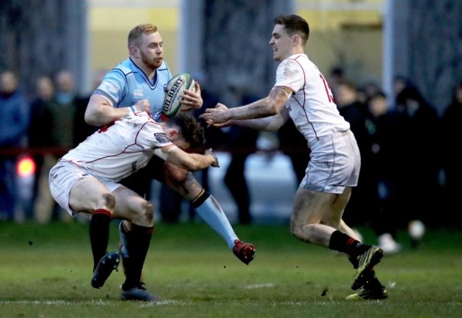 Conall Doherty is tackled by Jack Kelly