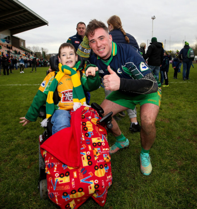 Tomas McLaughlin celebrates after the game with Bernard Power