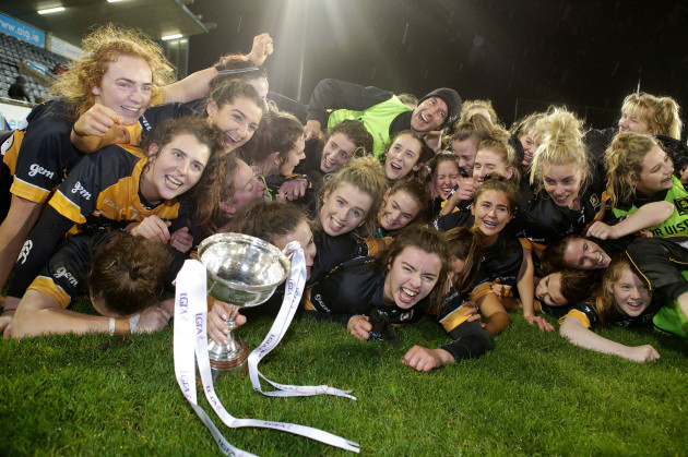 Mourneabbey's players celebrate with the trophy