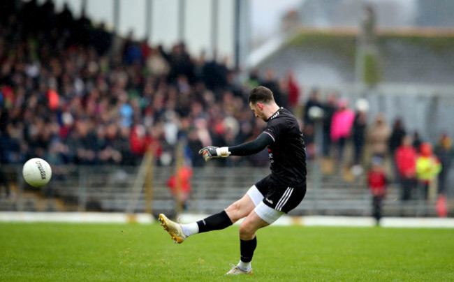 Niall Morgan kicks a free