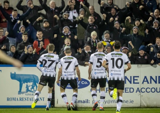 Dundalk players celebrate Michael Duffy's goal with the fans