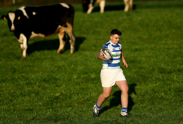 Matthew Kelly retrieves the ball from a field following a conversion