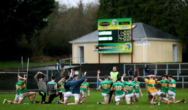 The Leitrim team warm down with the final score from the penalty shoot out on the scoreboard