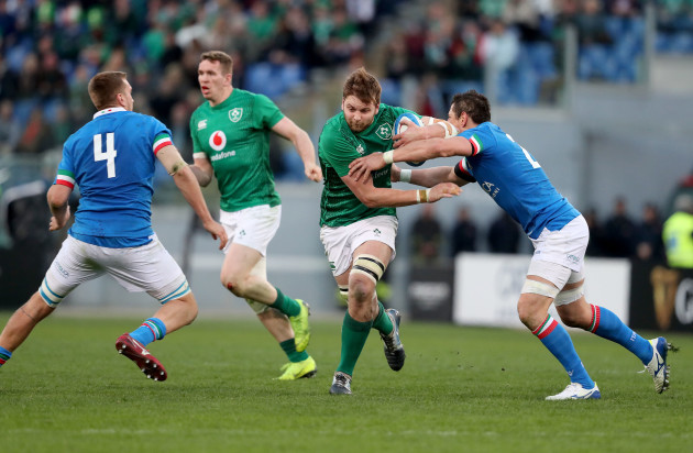 Iain Henderson is tackled by Alessandro Zanni