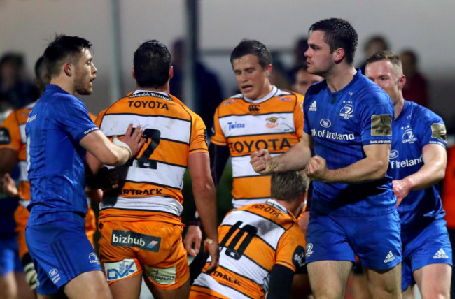 Conor O’Brien celebrates scoring a try with Ross Byrne