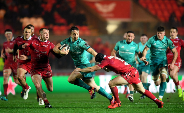 Darren Sweetnam is tackled by Leigh Halfpenny