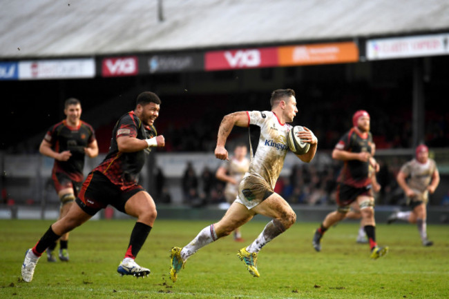 John Cooney makes a break to score his sides third try