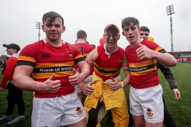 Alex O'Brien and James Moyhan celebrate with a fan after the game