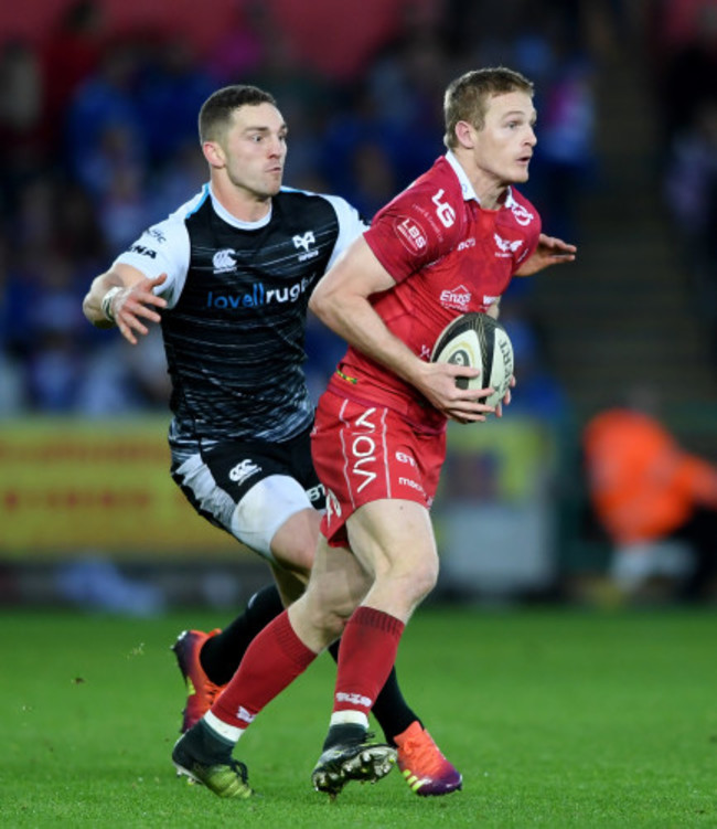 Johnny McNicholl is tackled by George North