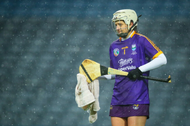 Mags D&rsquo;Arcy dries her hurley during a downpour