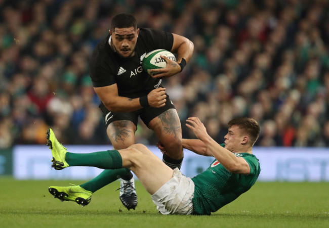 New Zealand's Ofa Tuungafasi is tackled by Ireland’s Garry Ringrose