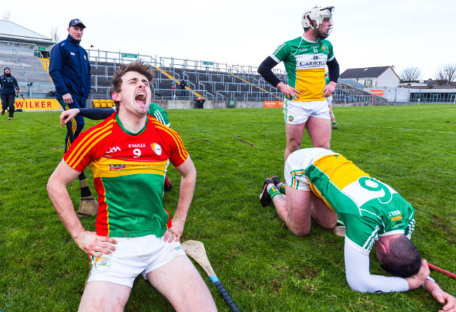 Sean Whelan celebrates winning while Pat Camon and Sean Dolan look on dejected