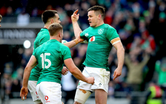 Jonathan Sexton celebrates scoring their second try with Jordan Larmour and Conor Murray