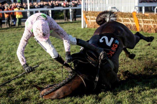 Rugby Walsh falls off Benie Des Dieux during the OLBG Mares' Hurdle