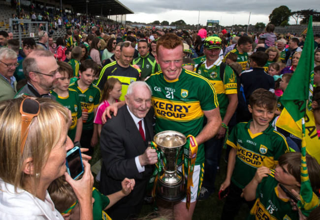 Johnny Buckley poses for photos with the cup