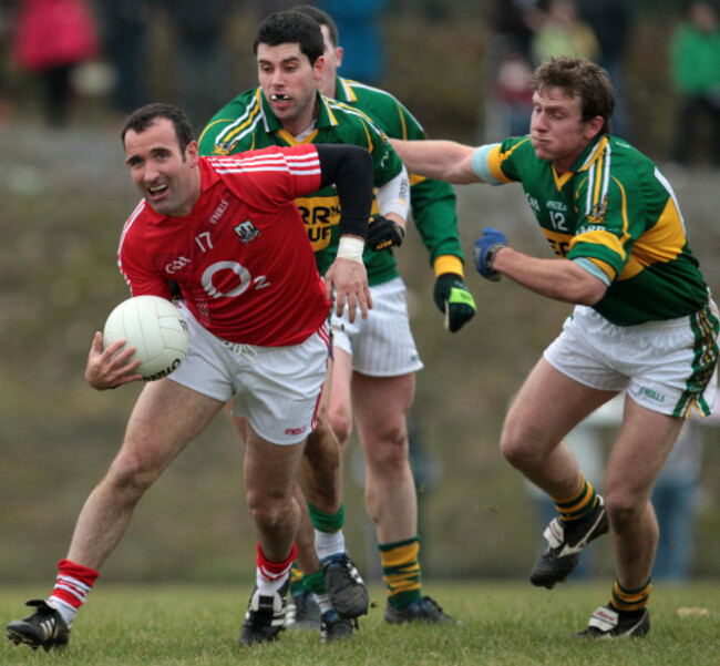 David Geaney and Donnacha Walsh tackle Kieran O'Connor