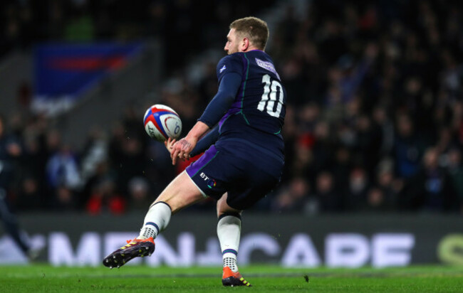 Finn Russell celebrates scoring a try