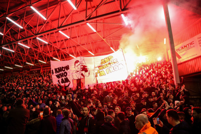 Bohemians fans light flares before the game