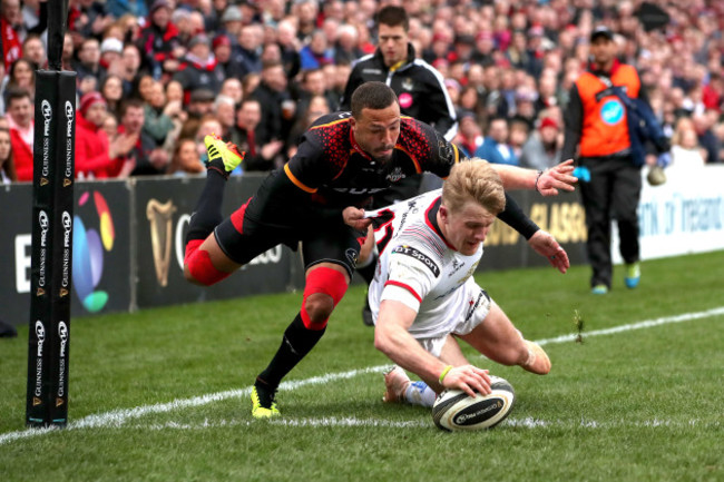 Rob Lyttle scores a try despite the efforts of Bjorn Basson