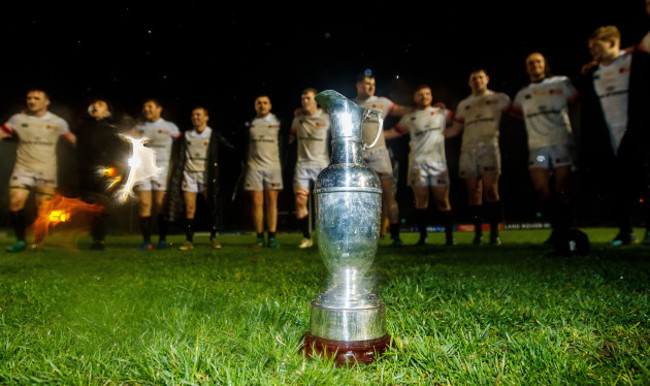 Trinity celebrate after the game with the trophy