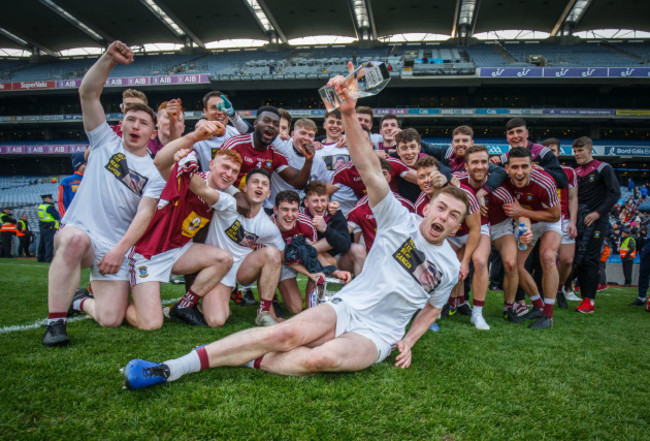 Ger Egan celebrates with his team mates after the game