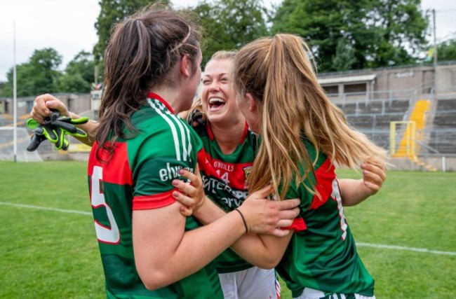 Sarah Rowe celebrates with Rachel Kearns and Sarah Mulvihill after the game