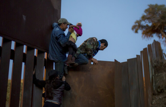 Migrants cross the border to the USA
