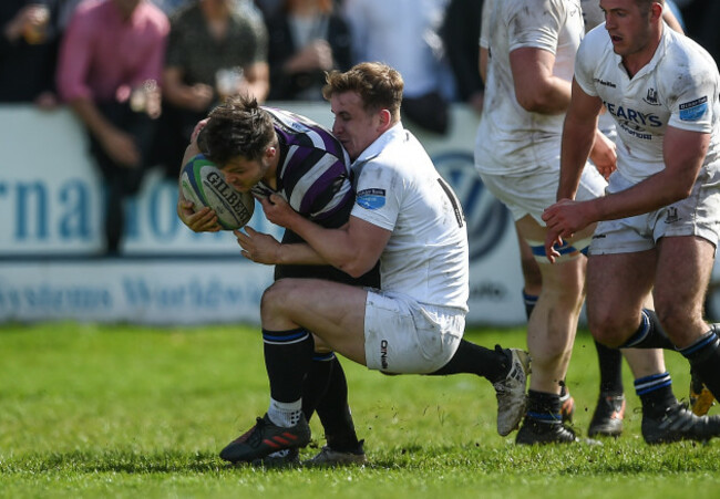 Sam Coghlan Murray is tackled by Rob Jermyn
