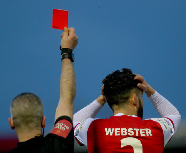 David Webster reacts after receiving a red card from Sean Grant