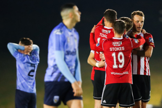 Darren Cole celebrates scoring a goal with teammates