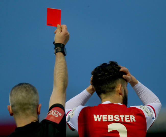 David Webster reacts after receiving a red card from Sean Grant
