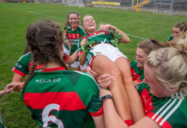 Sarah Rowe celebrates with team mates after the game