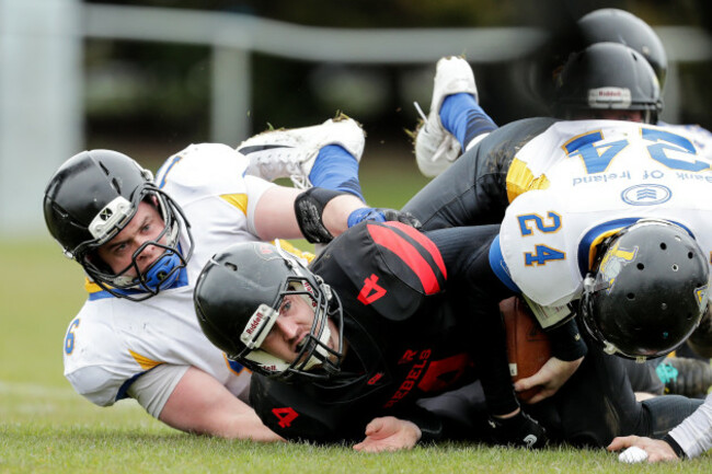 Jack Fagan scores a touchdown despite James Twomey and Sean Sheehy