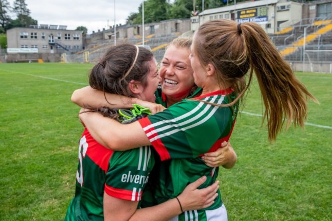 Sarah Rowe celebrates with Rachel Kearns and Sarah Mulvihill