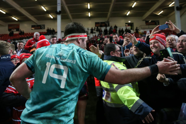 Billy Holland celebrates with fans after the game