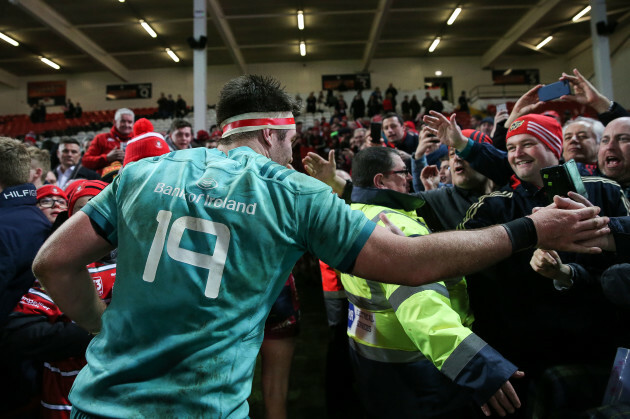 Billy Holland celebrates with fans after the game