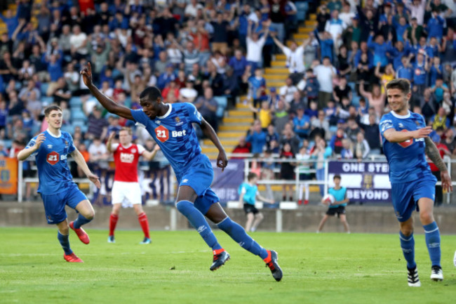 Izzy Akinade celebrates scoring a goal