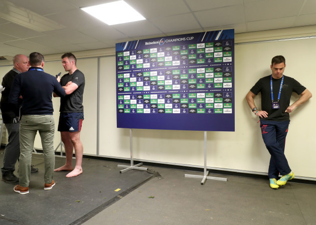 Johann van Graan dejected while Peter O'Mahony is interviewed after the game