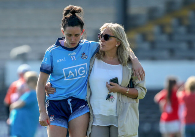 A dejected Niamh McEvoy of Dublin is comforted by her mother Joan end of the game