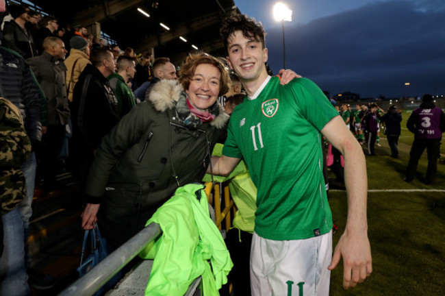 Neil Farrugia celebrates with Mary Farugia after the game