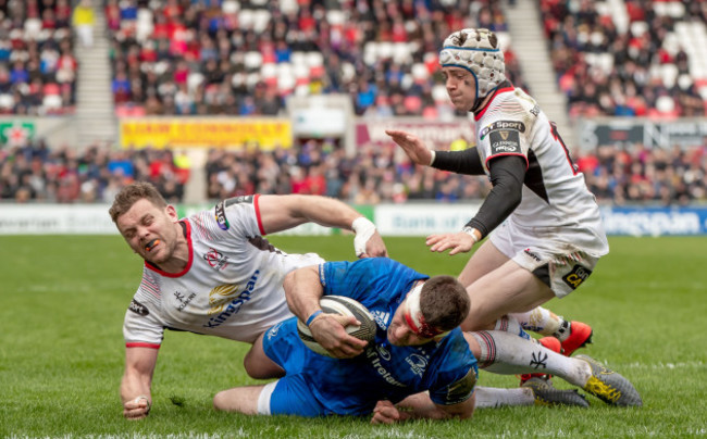 Darren Cave and Michael Lowry fail to stop Fergus McFadden from scoring a try