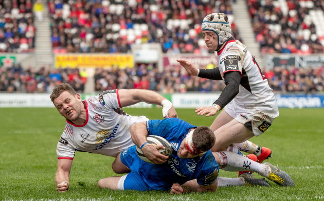 Darren Cave and Michael Lowry fail to stop Fergus McFadden from scoring a try